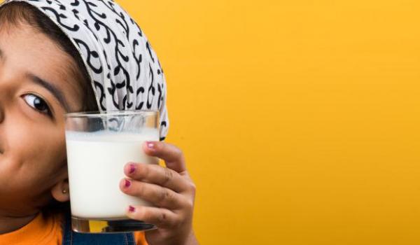 Child drinking 3.25 homogenized milk